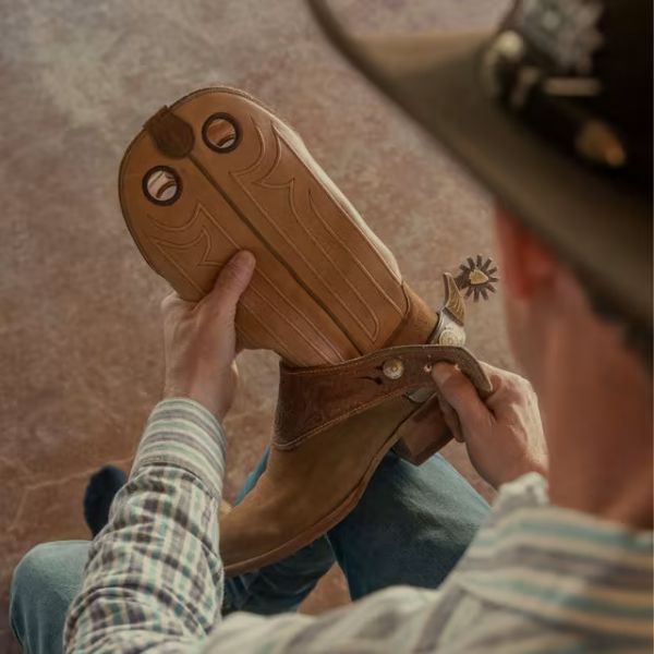 Man holding The Prescott Boots from Tecovas