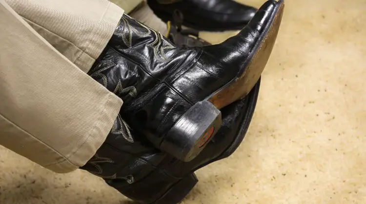 Man wear lizard cowboy boots and dress pants