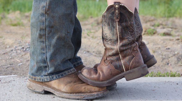 Men and women wearing cowboy work boots