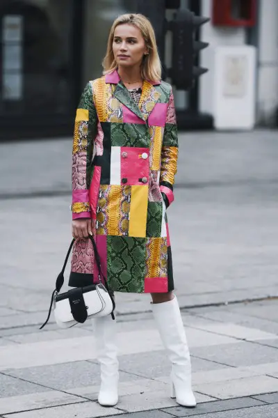 A woman wears textured dress with white cowboy boots