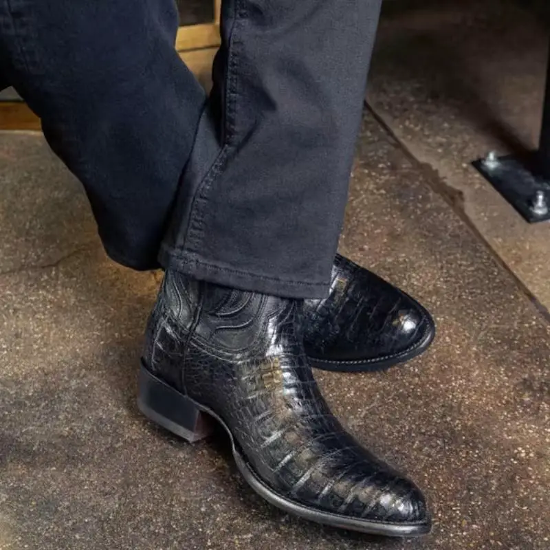a man wears The Dillon black caiman boots from Tecovas