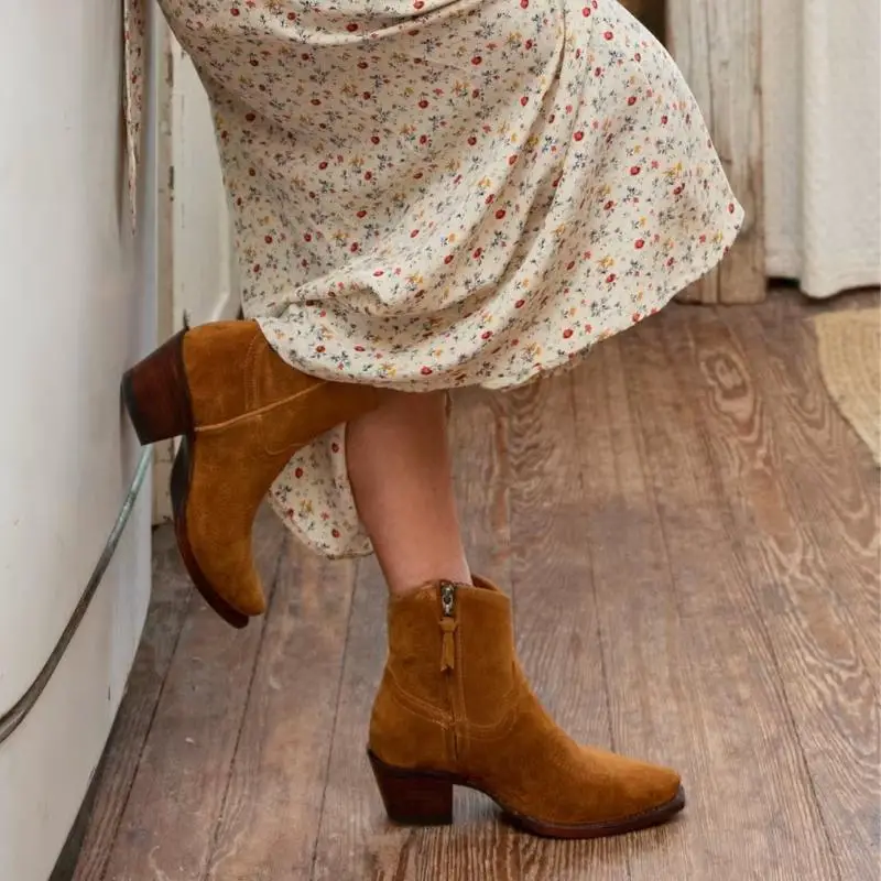 a woman wears dress with The Daisy suede boots from Tecovas