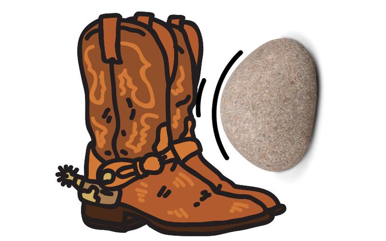 distressing cowboy boots with a rock