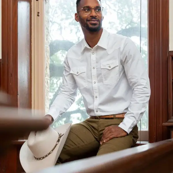 Man wear a white pearl snap shirt