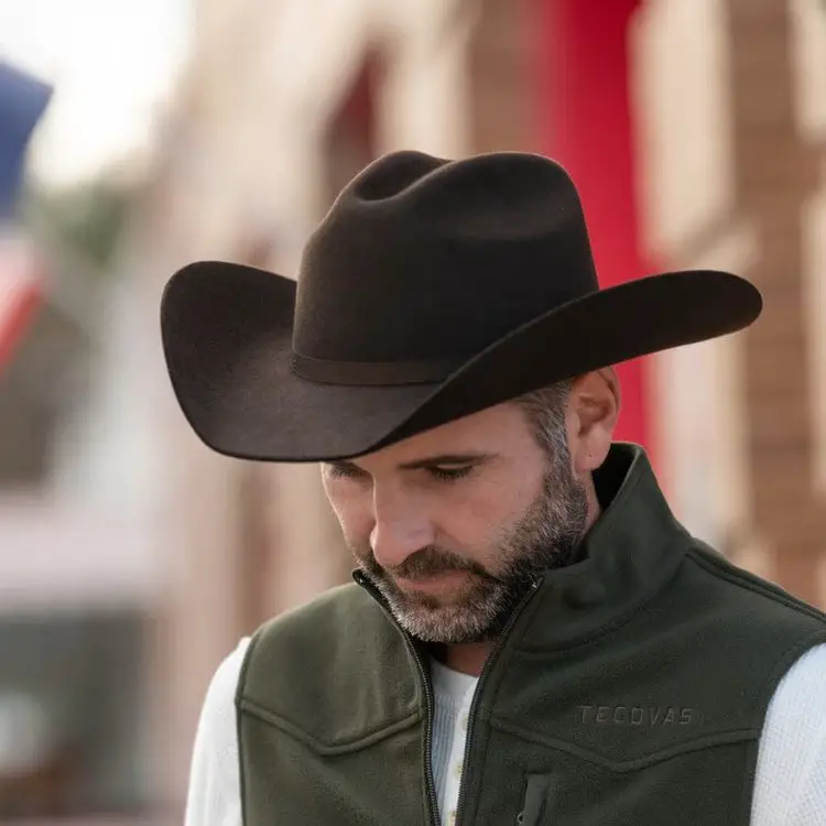 a man wears The Ranchman umber cowboy hat from Tecovas