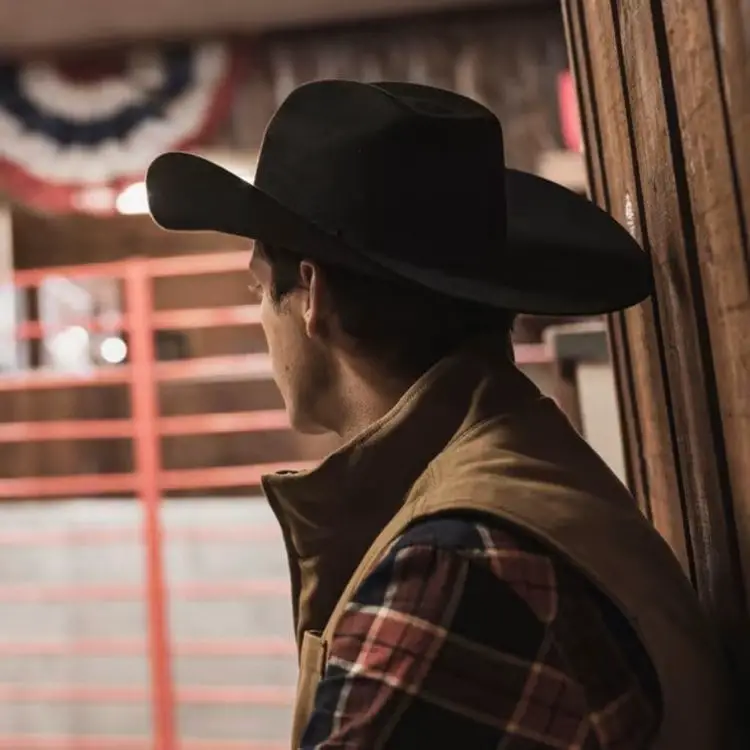 man wears The Ranchman black cowboy hat from Tecovas