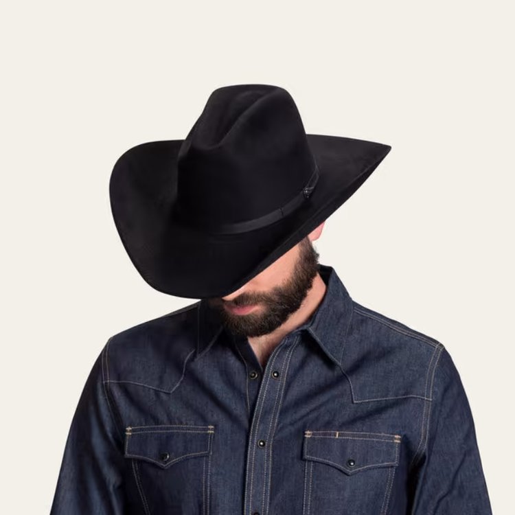 man wears The Ranchman felt cowboy hat from Tecovas