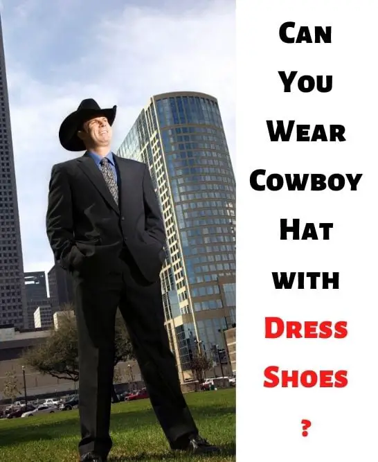 man wears cowboy hat with dress shoes and stands in apartment buildings