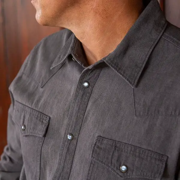 Man wear a Tecovas pearl snap shirt