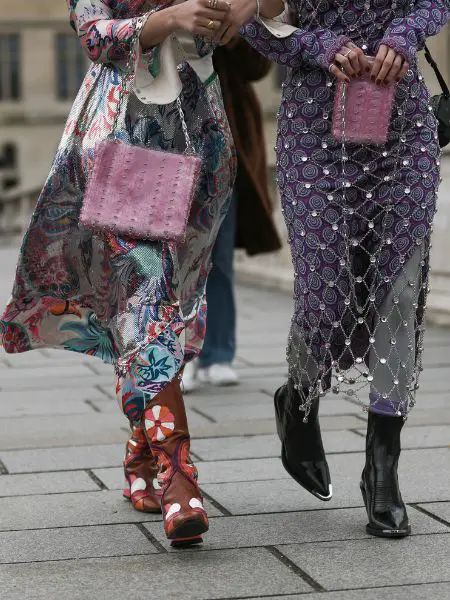 Women wears cowboy boots and maxi dress with modern style