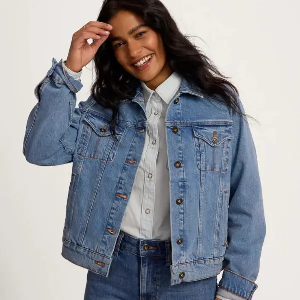 A woman wears Tecovas denim jacket, jeans and shirt