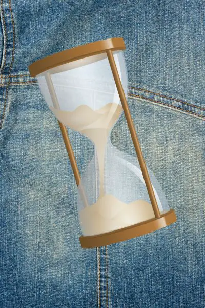 Jeans and sand clock