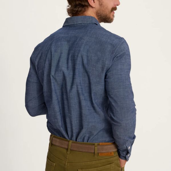 A man wears Tecovas Denim Shirt