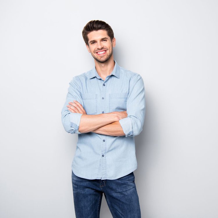 A man wears a denim shirt