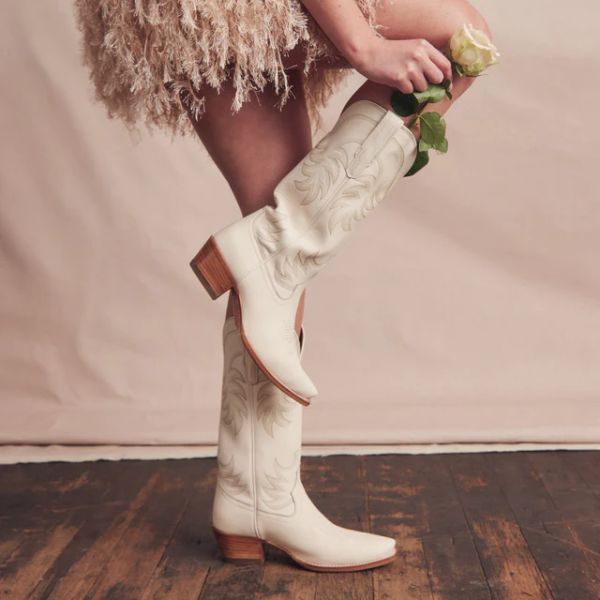 A woman wears The Annie Cowboy Boots from Tecovas