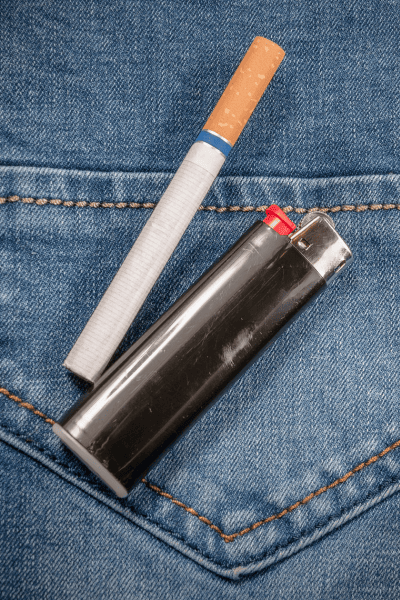 Cigarette on denim jeans