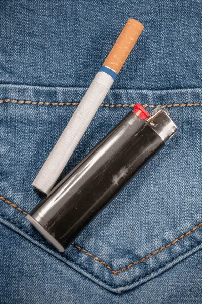 Cigarette on denim jeans