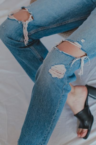 jeans are ripped at the knees
