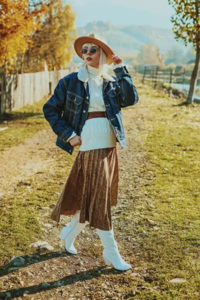 A woman wears cowboy boots for autumn