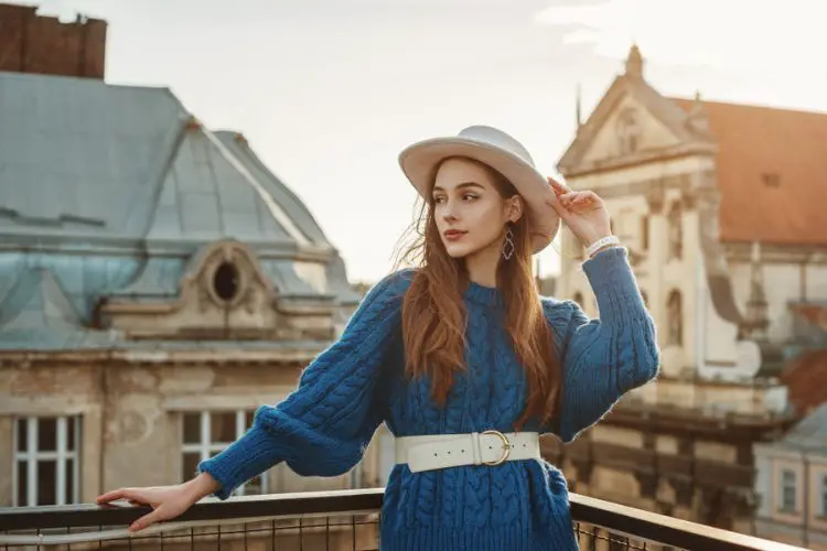 A woman wears midi skirt with sweater coat and shirts