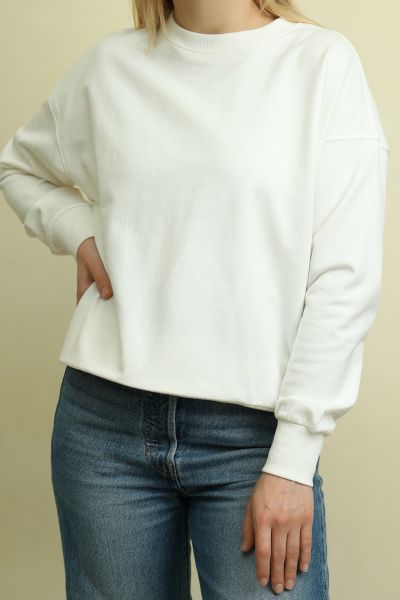 a white sweater dress with jeans