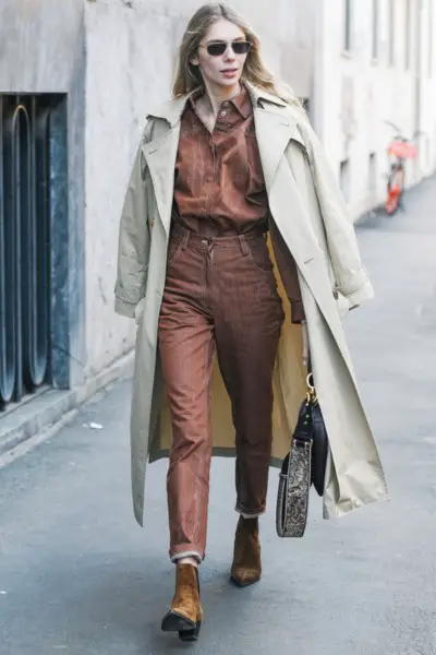 A woman wear beige blazer with sleek outfit and brown cowboy boots