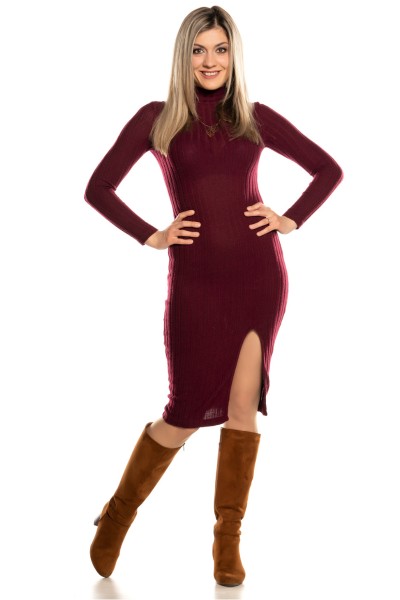 A woman wears cowboy boots with fitted dress