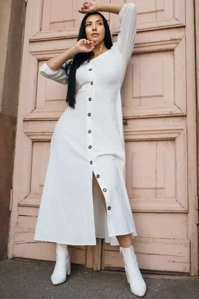 A woman wears white dress with cowboy boots (2)