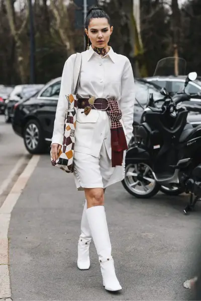 A cool girl wears white cowboy boots with white outfit