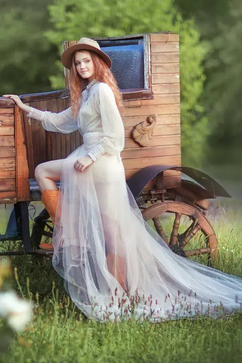 a bride wears wedding dress with cowboy boots