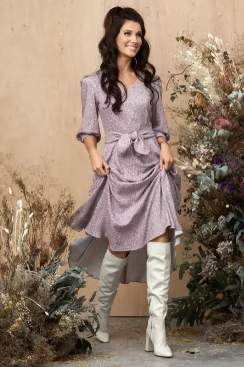 A-woman-wears-dress-with-white-cowboy-boots
