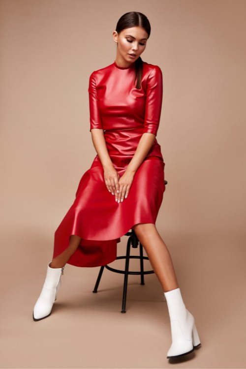 A-woman-wears-red-dress-with-white-cowboy-boots
