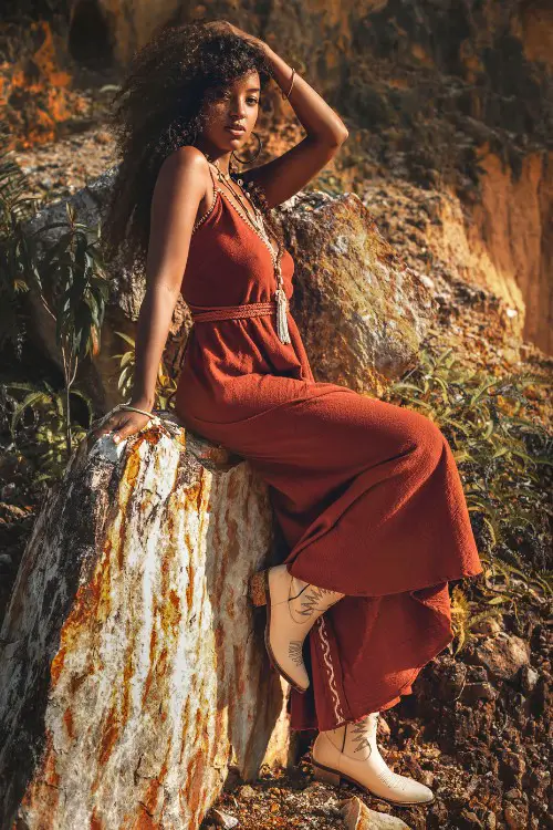 A woman wears white cowboy boots with red dress