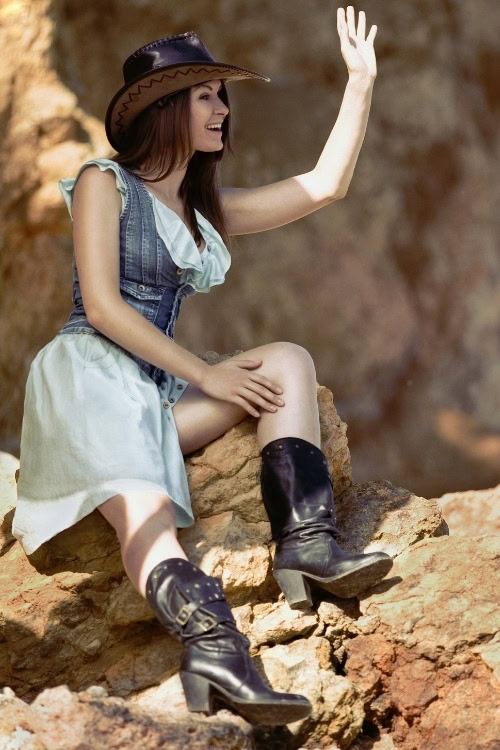 a woman wears black cowboy boots with a dress (2)