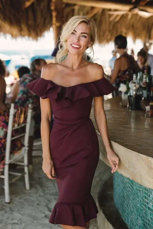 a woman in a deep wine off-shoulder midi dress with a ruffled hem (3)