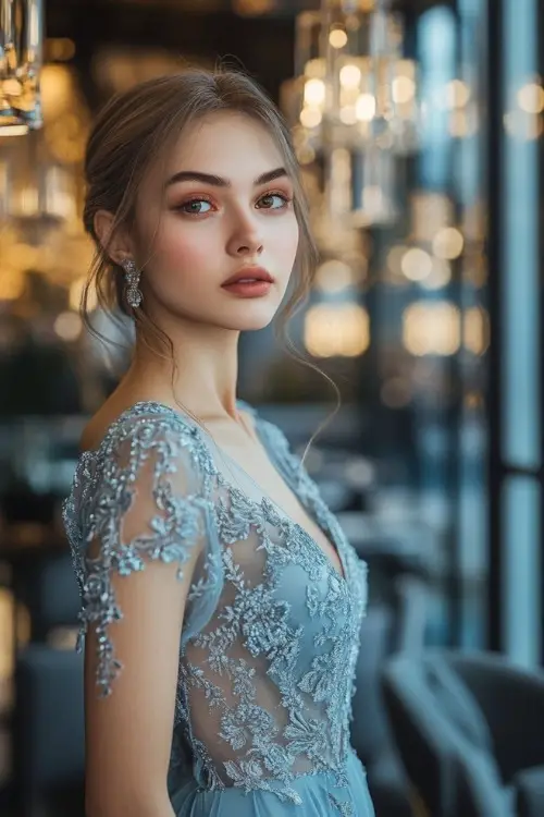 a woman wears a light blue lace wedding guest dress with a V neckline (3)