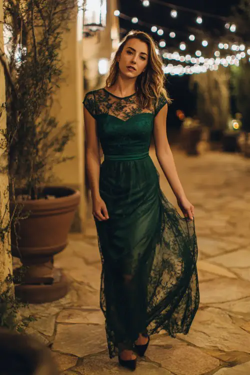 deep green lace evening gown, modest scoop neckline, cap sleeves with lace detailing, fitted bodice and flowing skirt