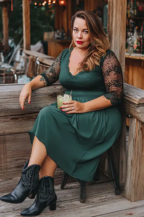 A plus-size woman over 40 wears a forest green midi dress with lace sleeves and black heeled cowboy boots
