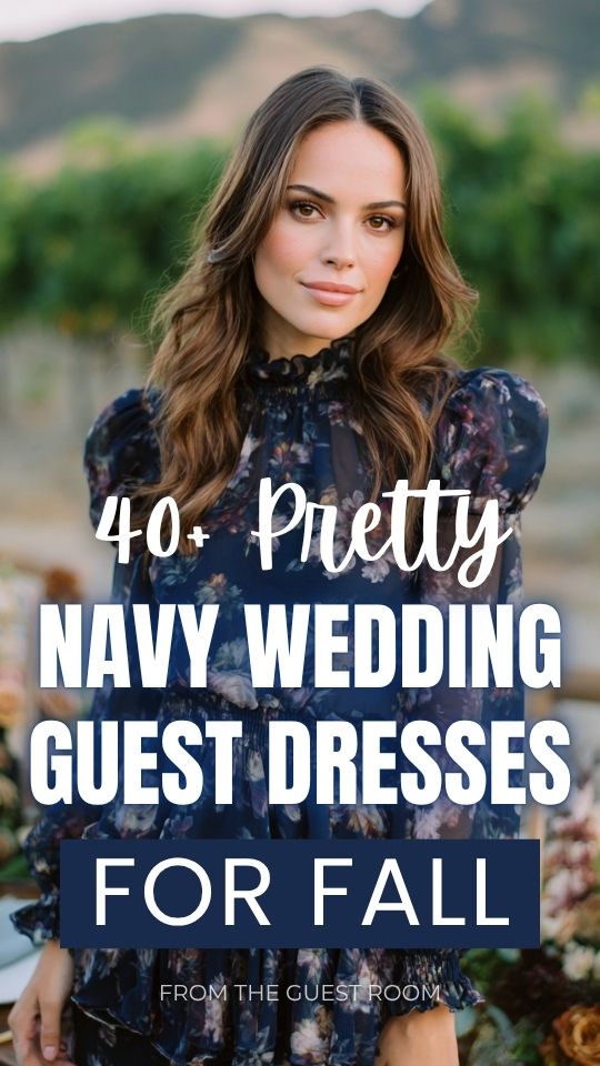 a petite woman in a navy fall wedding guest dress with ruffled hem and balloon sleeves