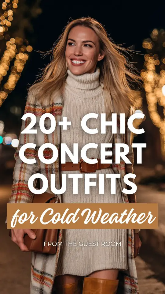 A stylish woman stands outdoors amid warm, glowing evening lights. She wears a cream ribbed turtleneck sweater dress cinched at the waist with a tan belt