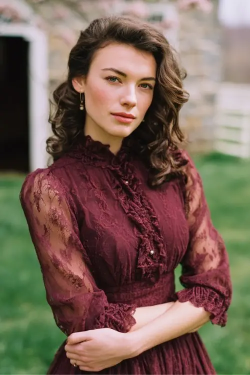 A woman over 30 wears a romantic burgundy lace midi dress with embroidered cuffs, scalloped neckline, and classic pumps