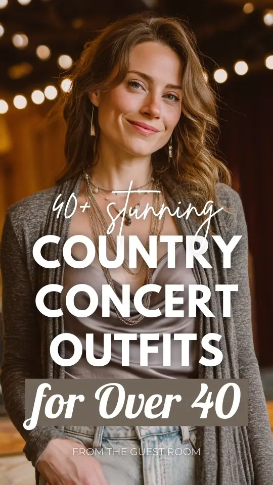 Sophisticated woman over 40 wearing country concert outfit with a grey draped cardigan over satin cami, light wash jeans, cowboy boots, layered necklaces