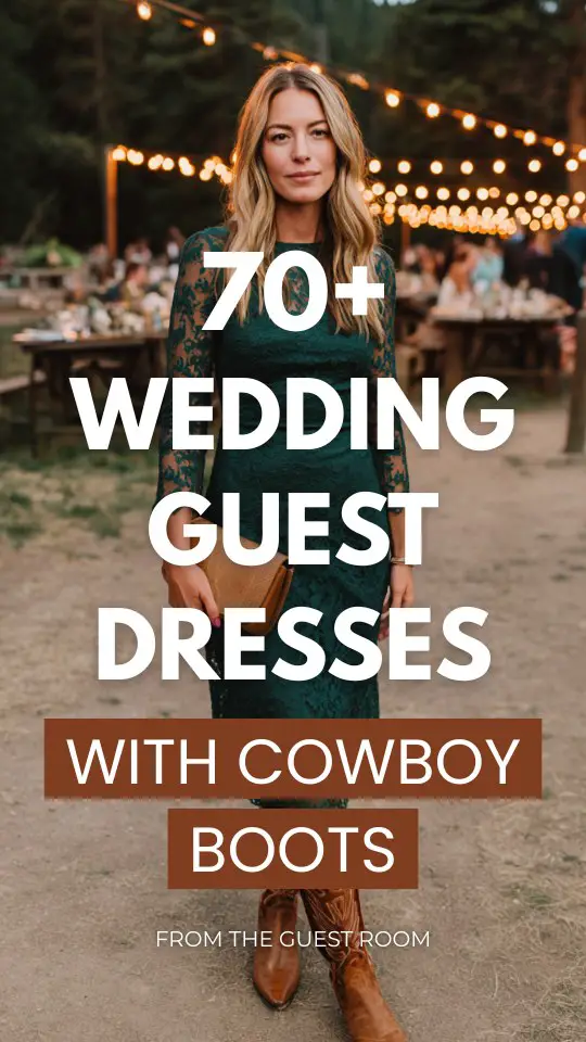 A woman wears a lace midi wedding guest dress in deep forest green with cowboy boots, and a structured clutch