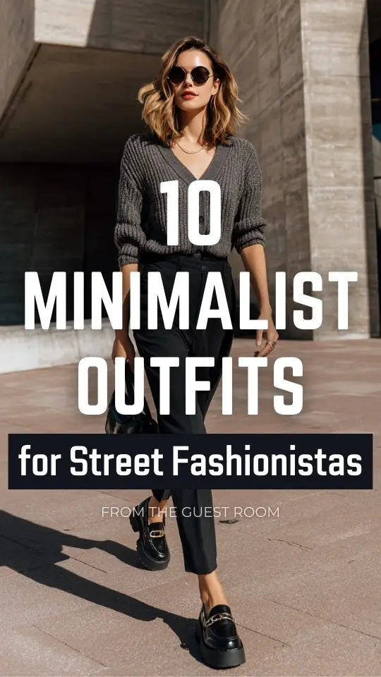 A woman wearing a street style minimalist outfit with a charcoal gray knit top tucked into black tailored pants, styled with chunky loafers and a sleek shoulder bag