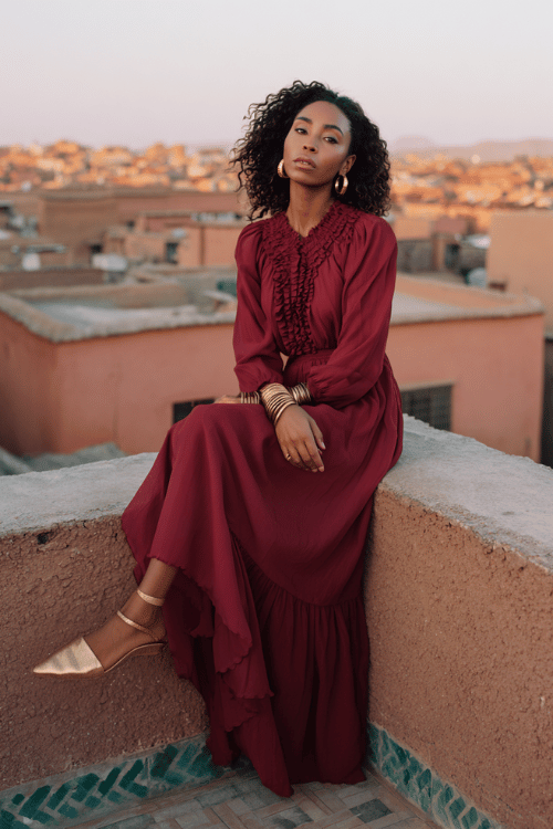 Deep burgundy maxi dress with romantic ruffle detailing creates a graceful and sophisticated look that feels perfect for rooftop dinners