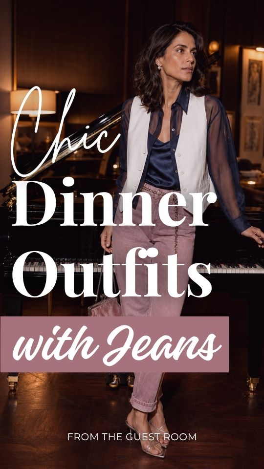 A woman wears a dinner outfit with jeans, sheer navy blouse with a cream vest, and strappy heeled sandals