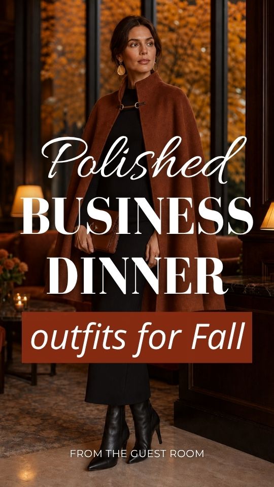 A woman wears polished business dinner outfit for fall with a rust cape coat, black midi dress, and knee-high boots