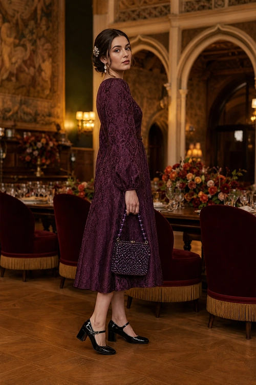 Burgundy Lace Midi Dress Outfit A woman wears a burgundy long-sleeved lace midi dress with black Mary Jane heels and a beaded handbag in an elegant dining room.