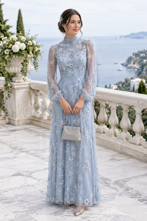Blue Lace Evening Dress A woman wears a floor-length pale blue lace dress with sheer long sleeves, a silver clutch, and embellished shoes.